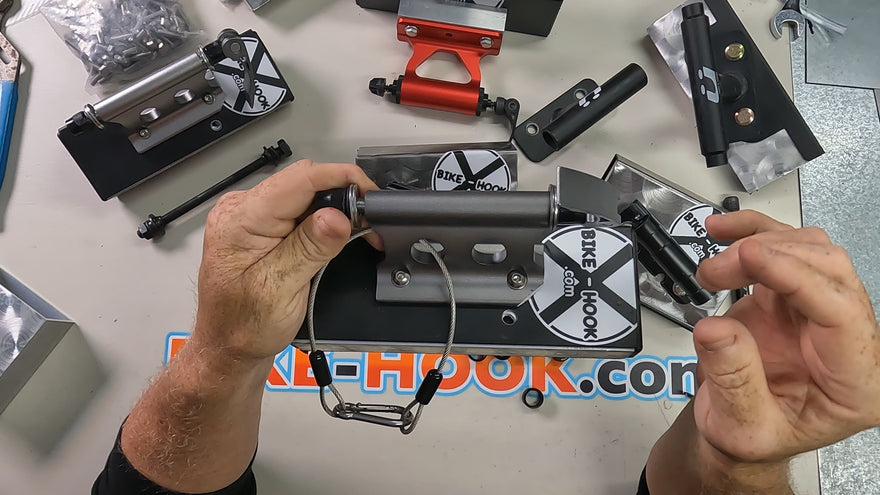 "Bike-Hook mounted outside a RAM Promaster van with front fork quick release skewer"