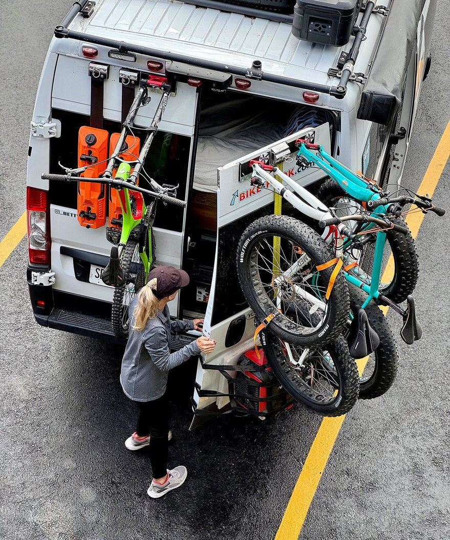 3 bicycles on a campervan rear door 