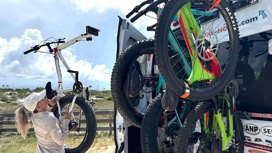 Loading a bicycle onto a rear door of a camper van