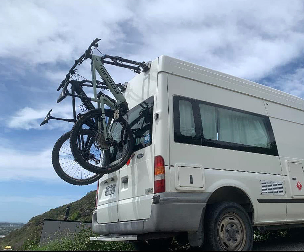 e Bikes mounted on bike-hooks rear door bicycle mounts