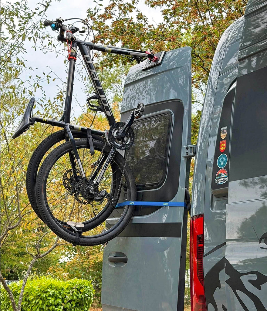 Hymer Mercedes Sprinter rear door open with two bicycles mounted on Bike-Hook carriers