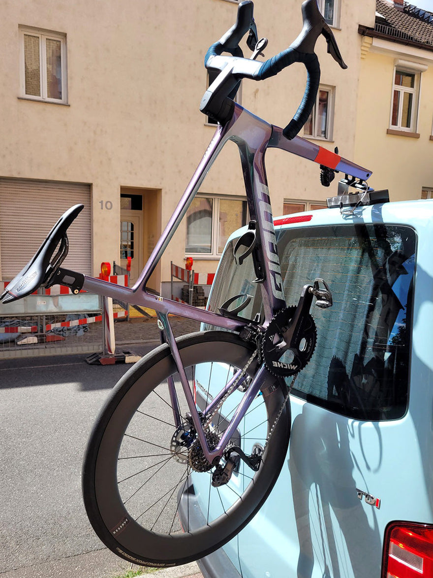 Giant Road bike on Bike-Hook rear van door VW transporter