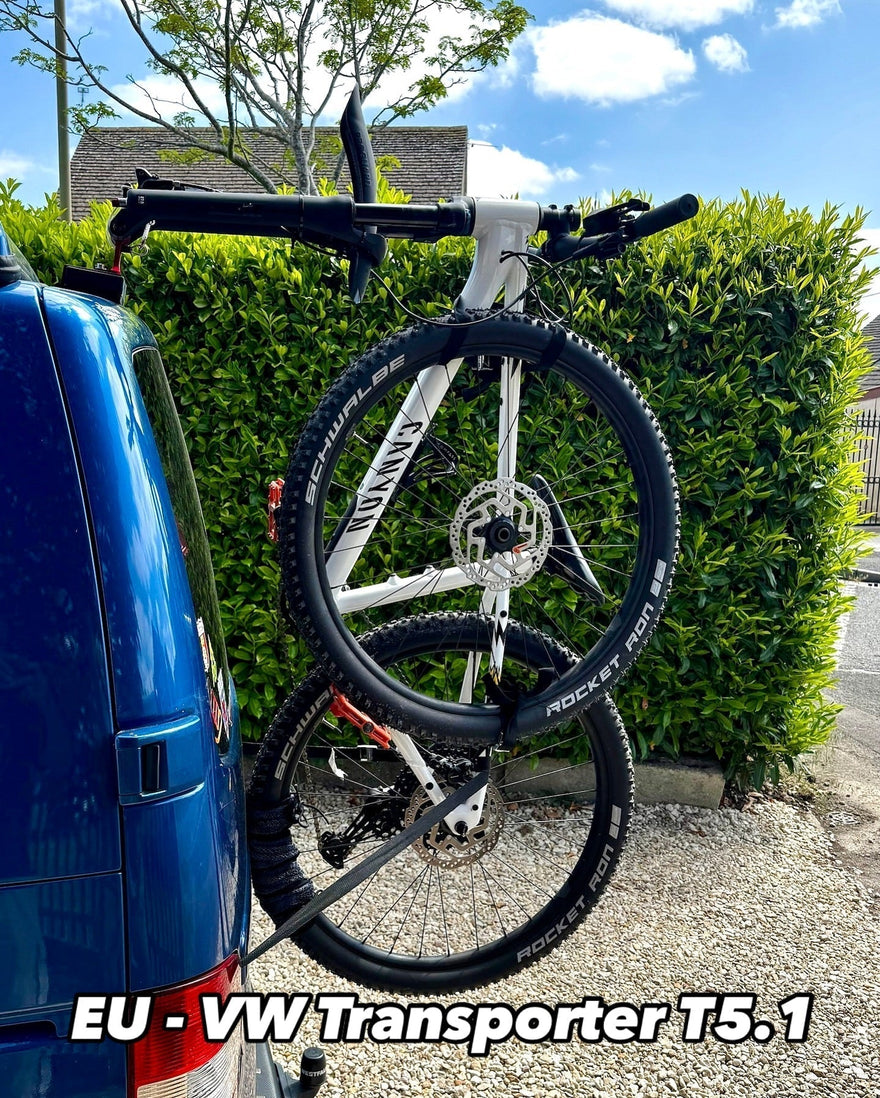 Fork mount bike rack installed on a Ford Transit rear door using the Bike-Hook system. Holds bikes vertically without drilling or a hitch, perfect for campervan travel
