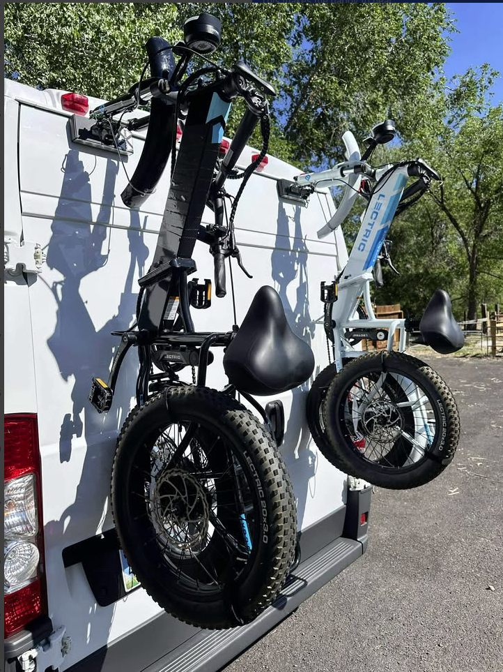 eBike mounted on Bike-Hook vertical rack system on a campervan rear door, demonstrating hitch-free travel setup