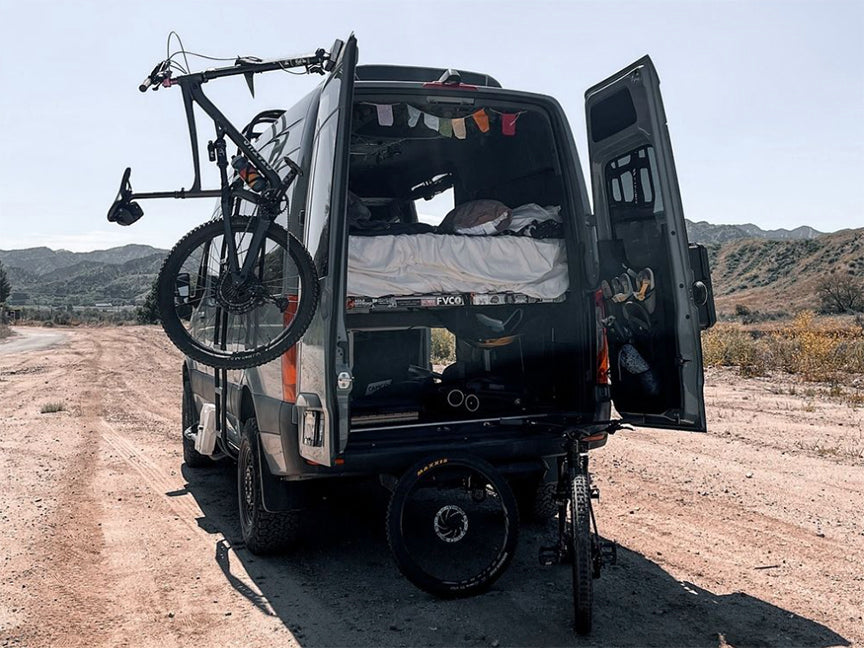 Fork-mount rear door bike rack for Mercedes Sprinter campervans. Quick install, rugged build—perfect for van life and off-grid biking. Bike-Hook 