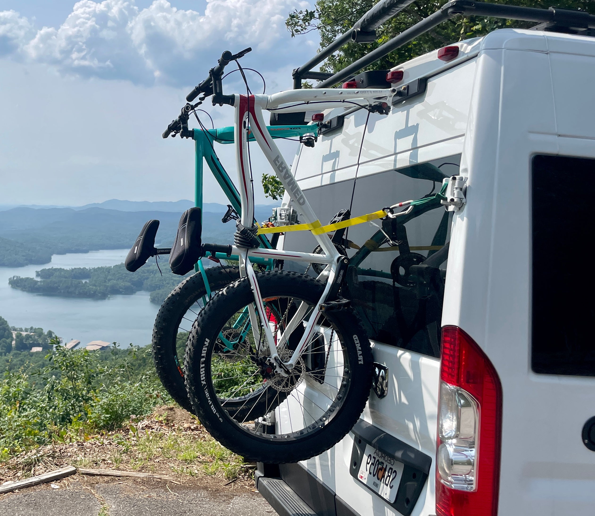 RAM ProMaster with Bike-Hook fork-mount rear door bike rack for secure storage.