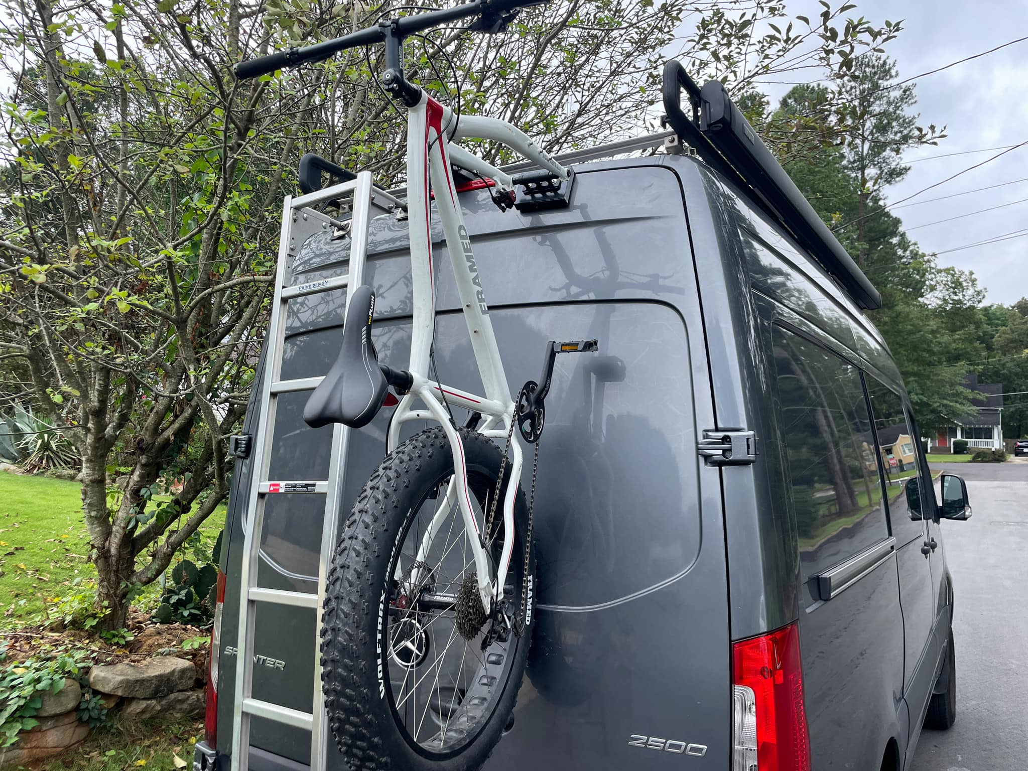 Secure rear door bike rack for Mercedes Sprinter vans. Fork-mount design, no-drill install—ideal for campervan conversions and bike trips.