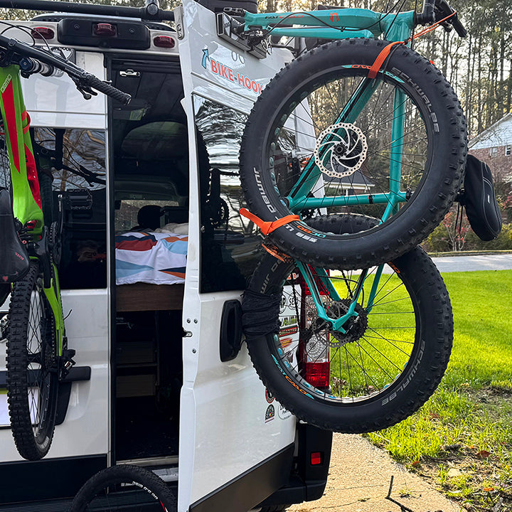 RAM ProMaster featuring Bike-Hook rear door fork-mount bike rack, ideal for van lifers.