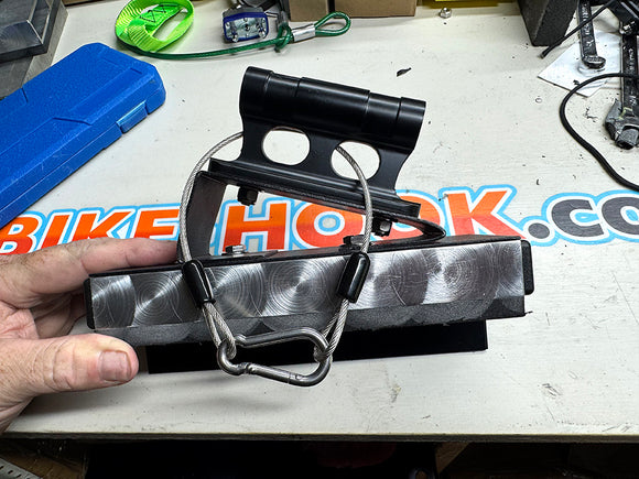 Fork mount bike rack installed on a Volkswagen Transporter T5 T6 rear door using the Bike-Hook system. Holds bikes vertically without drilling or a hitch, perfect for campervan travel.

