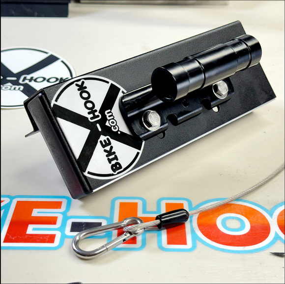 Close-up of a Bike-Hook that can mount on a  Ford  Transit Custom  campervan, demonstrating how to store a bicycle securely using a no-drill, low-profile mount.

