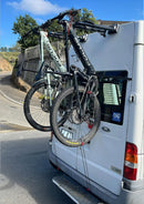 2up bicycles on Ford Transit rear door bike storage
