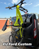 Fork mount bike rack installed on a Ford Transit Custom rear door using the Bike-Hook system. Holds bikes vertically without drilling or a hitch, perfect for campervan travel.

