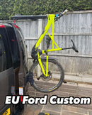 Fork mount bike rack installed on a Ford Transit Custom rear door using the Bike-Hook system. Holds bikes vertically without drilling or a hitch, perfect for campervan travel.

