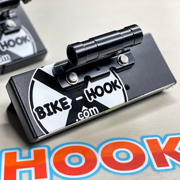 Adventure van with 3 bikes on rear doors using Bike-Hooks. Modular design lets van lifers avoid bulky swing-away racks for e-bikes or mountain bikes.

