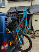 up to 4 bicycles mounted on a VW Transporter T6 using Bike-Hooks, showcasing easy access to rear doors and lightweight fork mount system.  No hitch or drilled mounts